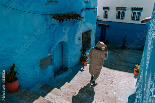 One man walking in Chefchaouen city in Marocco © Anastasia C.