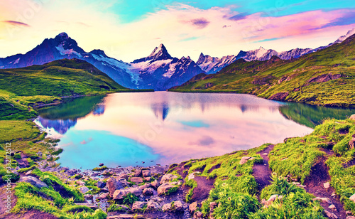 Obraz na płótnie Fantastic landscape at sunrise over the lake in the Swiss Alps, Europe. Wetterhorn, Schreckhorn, Finsteraarhorn et Bachsee. ( relaxation, harmony, anti-stress - concept). w salonie