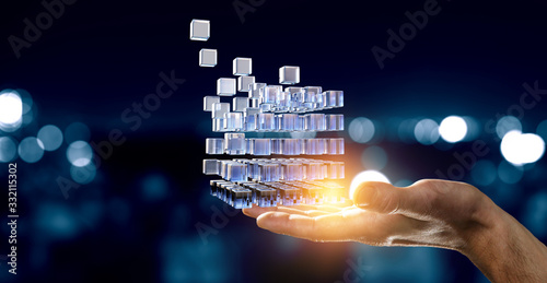 Hand holding glowing cubes. Innovation and creativity concept.