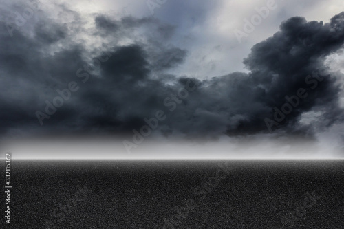 Fotografia Asphalt road and storm sky