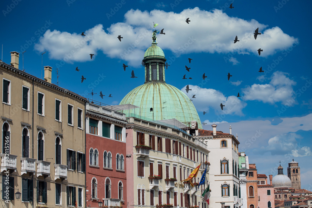 Colorful buildings and church dome in Venice