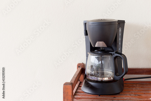 coffee maker on wooden table photo