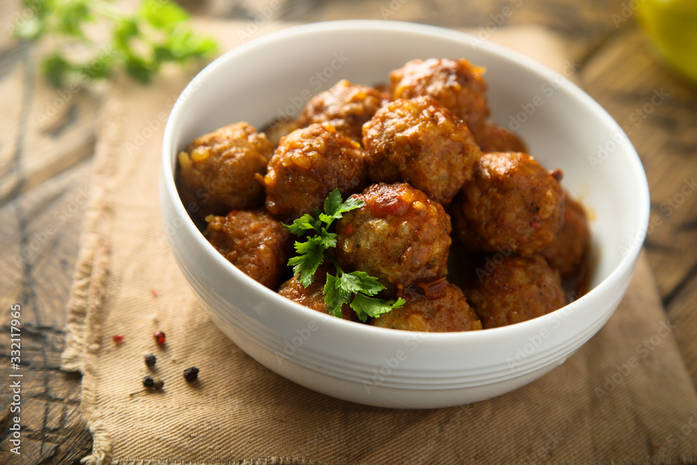 Homemade meatballs in a white bowl