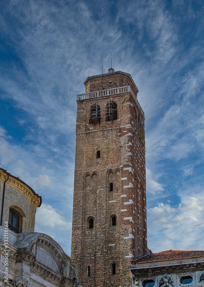 An ancient brick bell tower in Venice