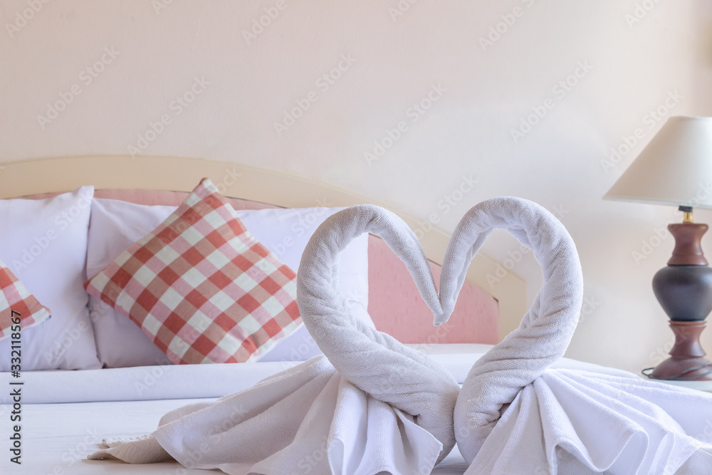 The swan towels on the bed