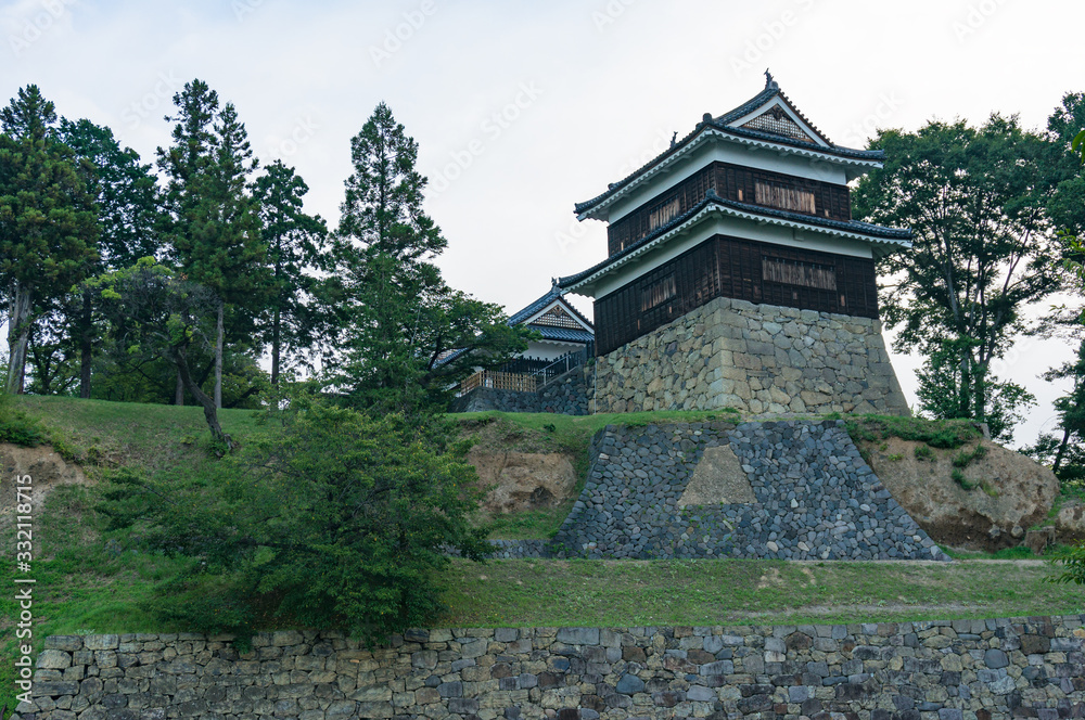 Traditional Japanese castle on stone hill. Ueda castle historic building Traditional Japanese castle on stone hill. Ueda castle historic building