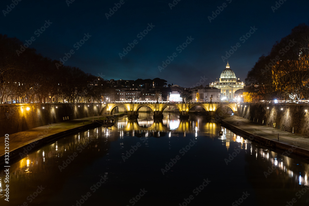 View over the Tiber with the Peter's church in the background at night.