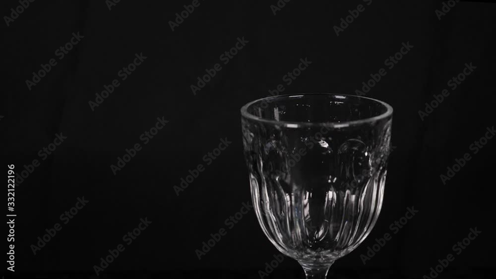 Pouring water into a glass Pouring water into a glass