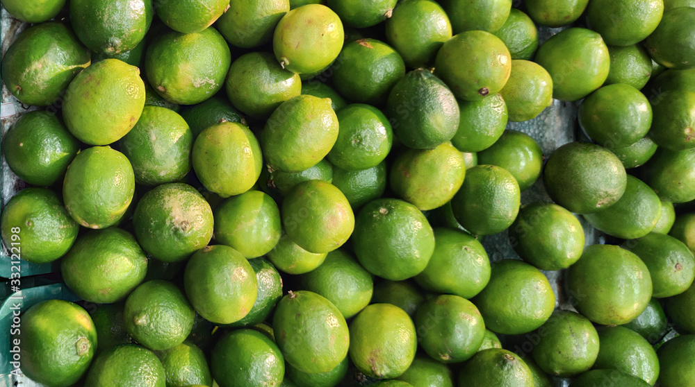 Galician lemon fruits (Citrus aurantifolia) and supermarket display counter in Brazil