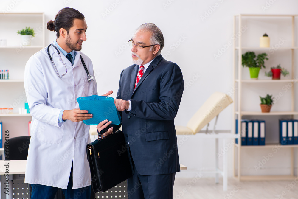 Male doctor and businessman discussing medical project Male doctor and businessman discussing medical project
