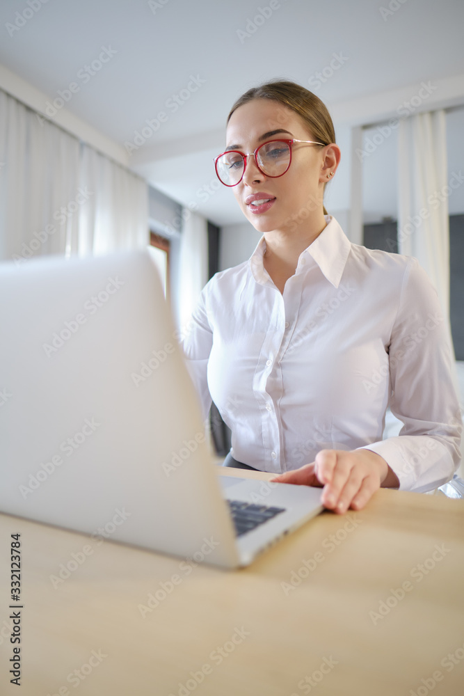 Work during quarantine, a woman at home works on the laptop Work during quarantine, a woman at home works on the laptop