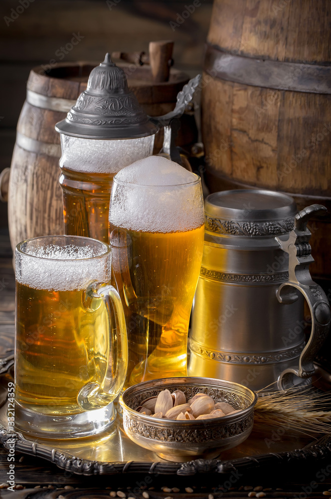 Light beer in a glass on a table in composition with accessories on an old background Light beer in a glass on a table in composition with accessories on an old background