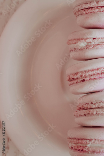 Strawberry french macarons closeup. Fresh and colourful on pink background