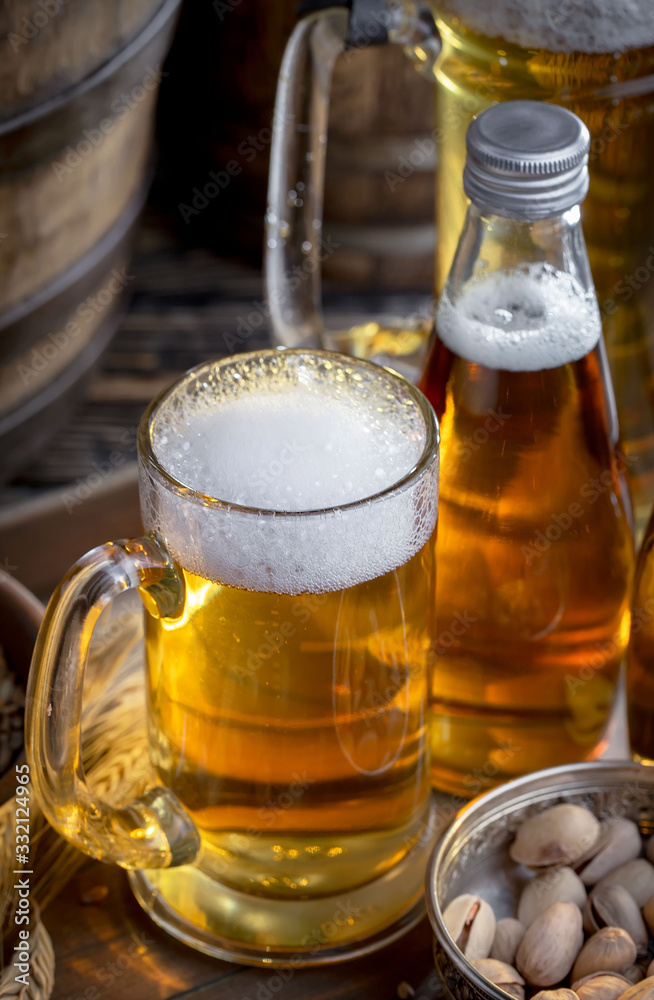 Light beer in a glass on a table in composition with accessories on an old background Light beer in a glass on a table in composition with accessories on an old background