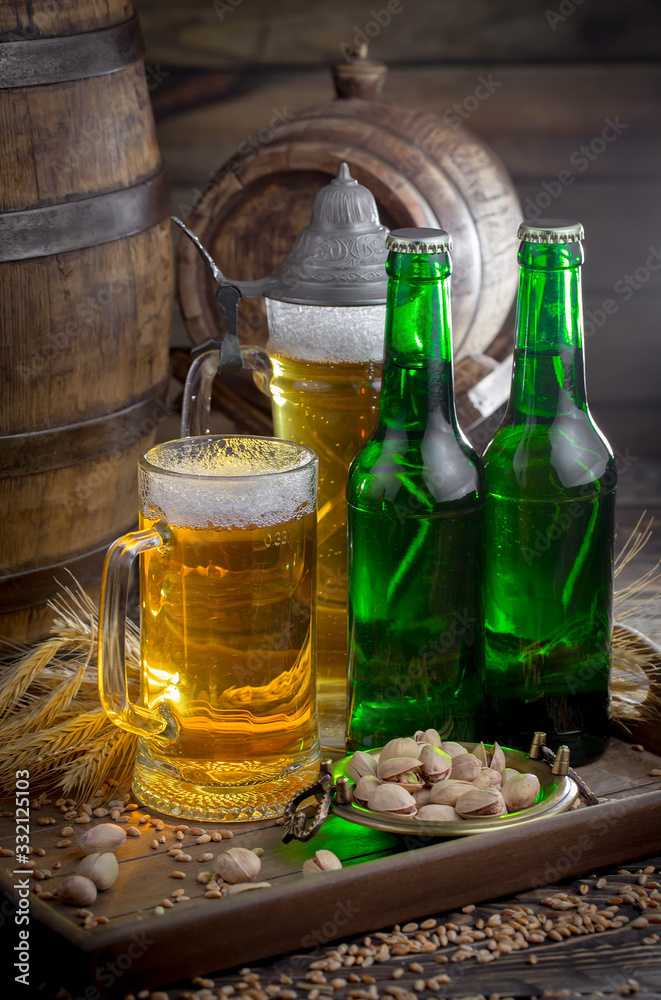 Light beer in a glass on a table in composition with accessories on an old background Light beer in a glass on a table in composition with accessories on an old background
