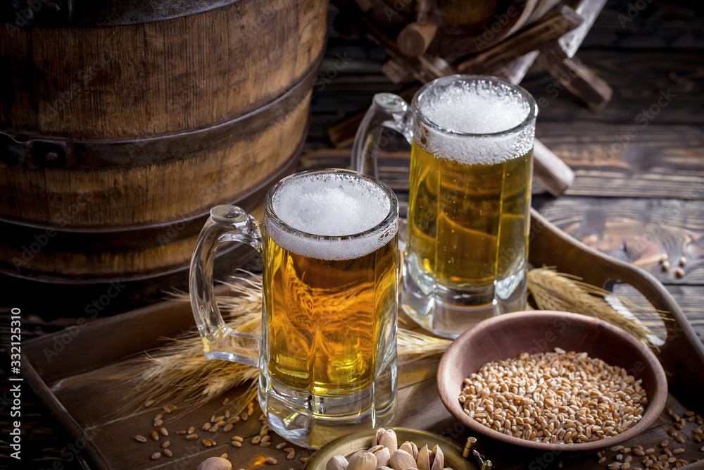 Light beer in a glass, on an old background. Light beer in a glass, on an old background.