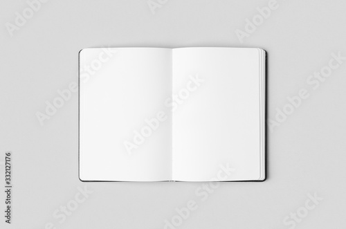 Notebook inside mockup on a grey background. photo