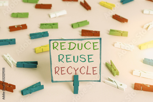 Word writing text Reduce Reuse Recycle. Business photo showcasing environmentallyresponsible consumer behavior Colored clothespin papers empty reminder pink floor background office pin photo