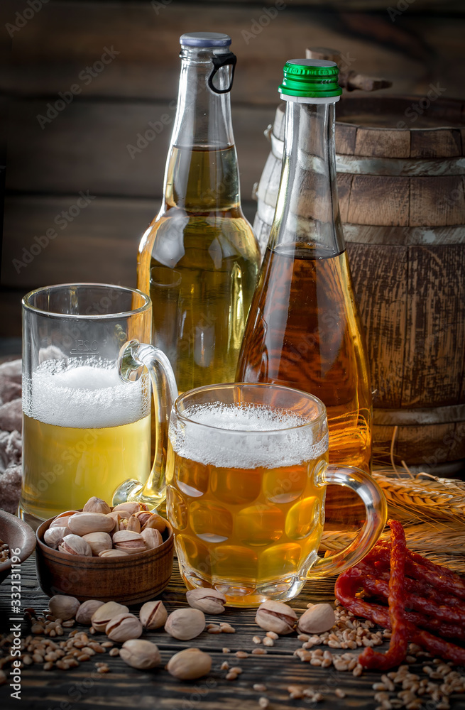 Light beer in a glass, on an old background. Light beer in a glass, on an old background.