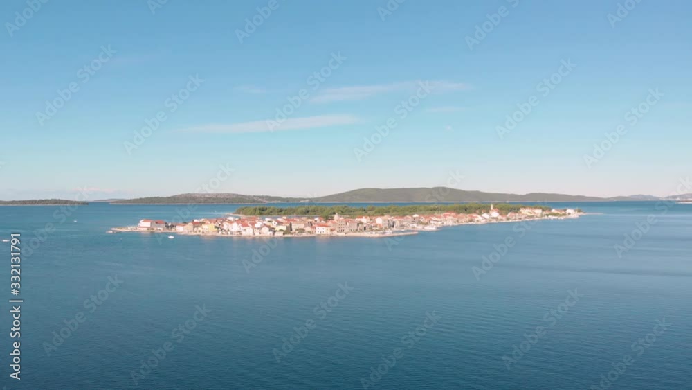 Aerial view of a isolated Krapanj island in the middle of Adriatic sea in Croatia, scenic travel touristic destination for summer holiday Aerial view of a isolated Krapanj island in the middle of Adriatic sea in Croatia, scenic travel touristic destination for summer holiday