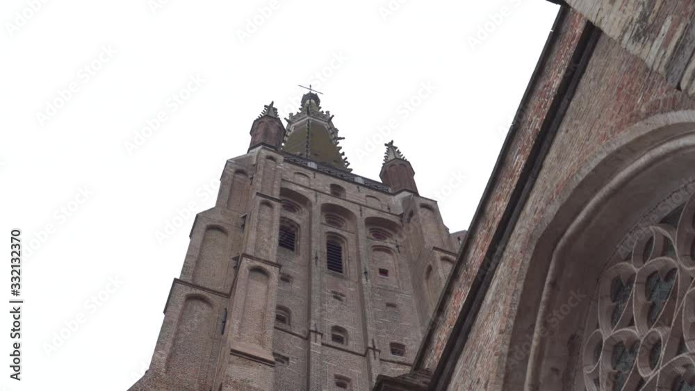 Tilted up Panning shot left to right of The Church of Our Lady/Église de Notre Dame, in Bruges. Tilted up Panning shot left to right of The Church of Our Lady/Église de Notre Dame, in Bruges.