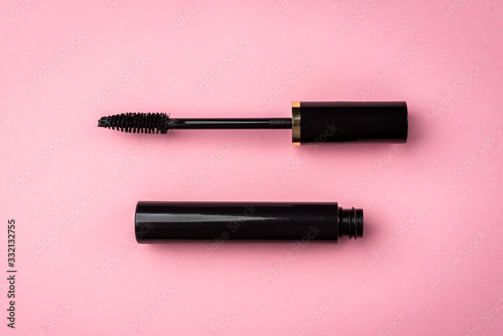 Mascara on pink background. Basic products for eyelashes makeup. - obrazy, fototapety, plakaty 