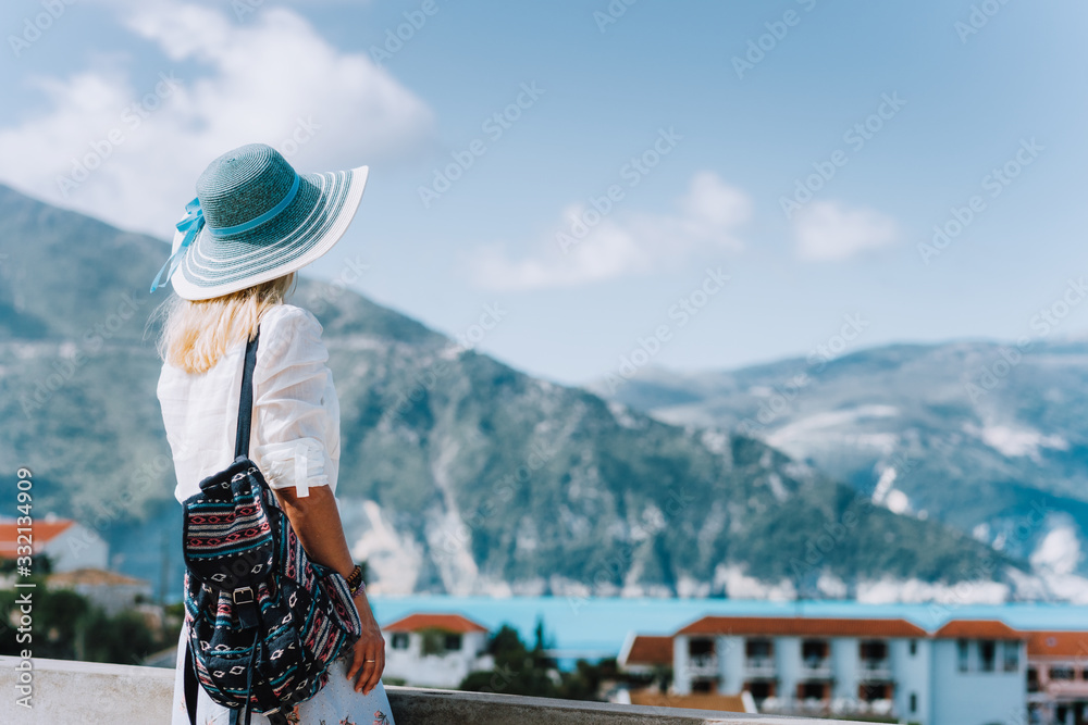 Female on holiday visiting greek Assos small town. Kefalonia, Greece. Sommer vacation vibes