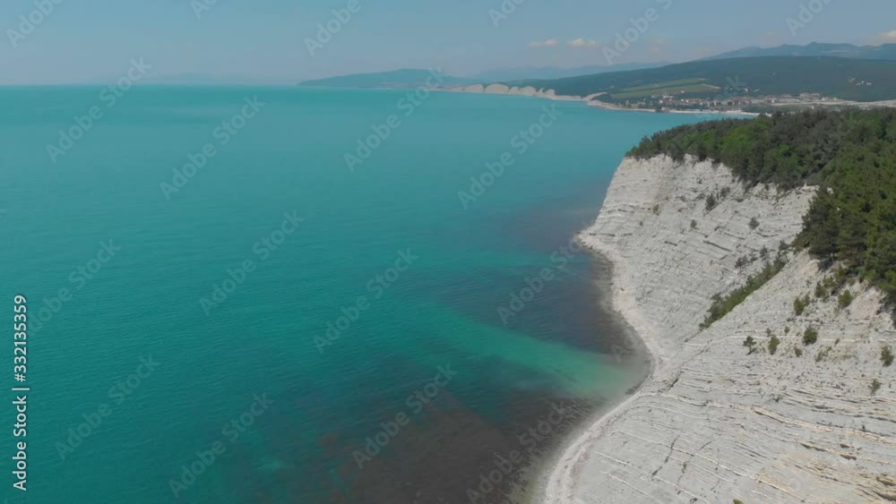Top view from Drone flying over the high white rocks with a blue see Top view from Drone flying over the high white rocks with a blue see