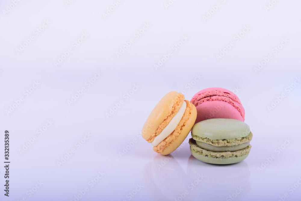 Colorful macaroons cake, sweet macaroon on white table background, food background Colorful macaroons cake, sweet macaroon on white table background, food background