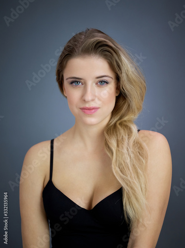 Portrait of nice pretty blonde lady isolated over grey background. Beauty and lifestyle concepts