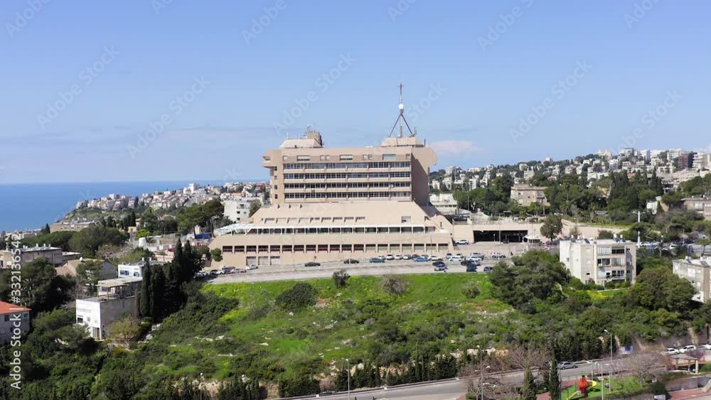 Aerial view of Carmel Hospital and surrounding houses on a clear day. Aerial view of Carmel Hospital and surrounding houses on a clear day.