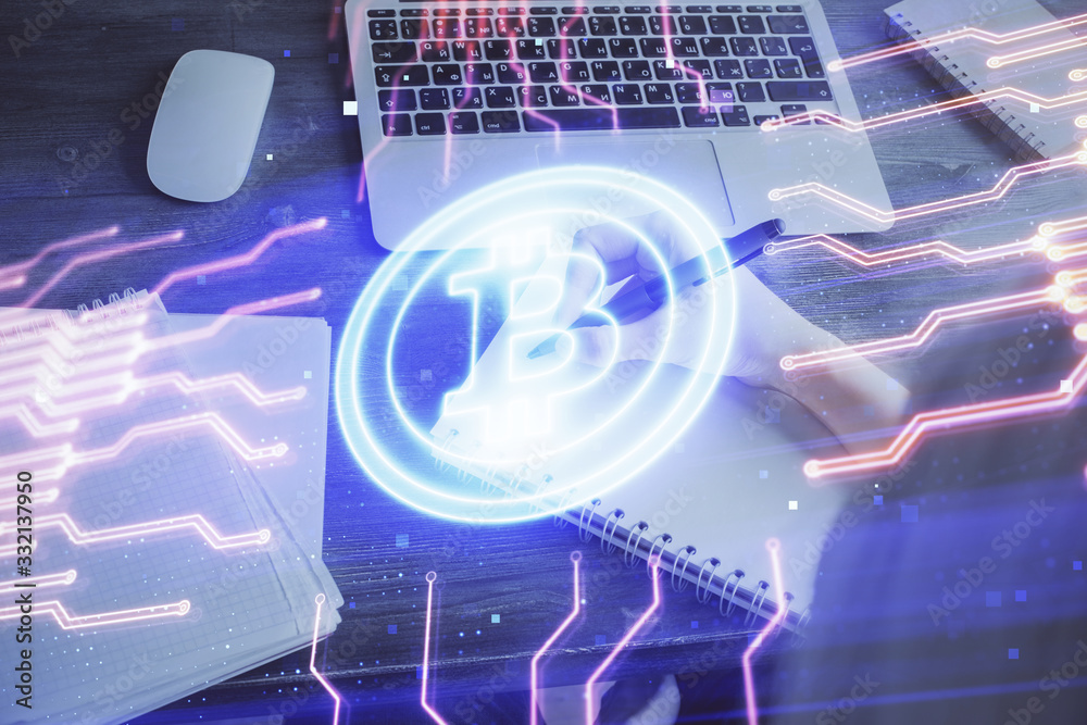 Cryptocurrency hologram over hands taking notes background. Concept of blockchain. Multi exposure Cryptocurrency hologram over hands taking notes background. Concept of blockchain. Multi exposure