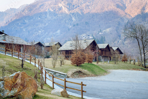 Fototapeta Naklejka Na Ścianę i Meble -  Village in the mountains with houses near the road
