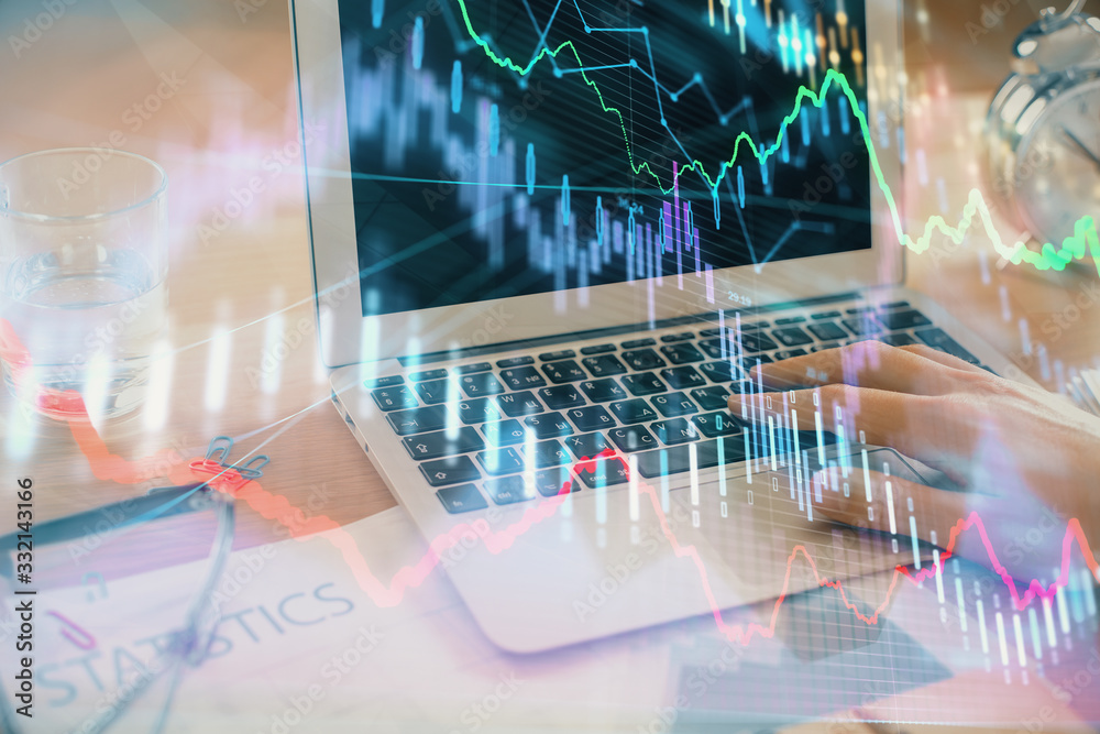 Multi exposure of market chart with man working on computer on background. Concept of financial analysis. Multi exposure of market chart with man working on computer on background. Concept of financial analysis.