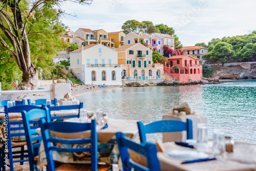 Table in Greek tavern in Assos fishing village, Kefalonia island, Greece