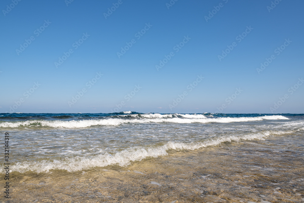 Scenic view of seascape with waves on coral seashore  