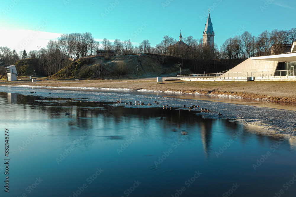 Landscapes of the banks of the Narova River on a spring sunny day