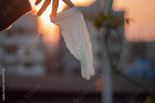 Hands gloves showing sign to prevent the infection from the outbreak of novel coronavirus