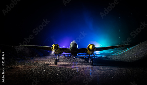 German Junker (Ju-88) night bomber at night. Artwork decoration with scale model of jet-propelled plane in possession.