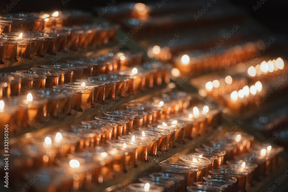 Burning candles in a church. Burning candles in a church.