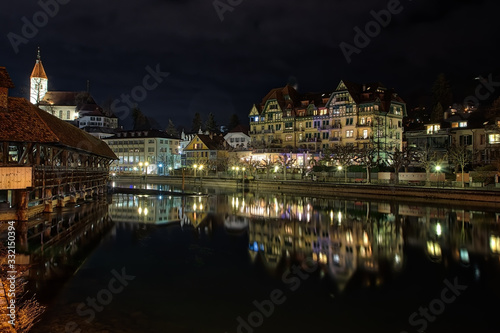 Night Light buildings with reflection in water
