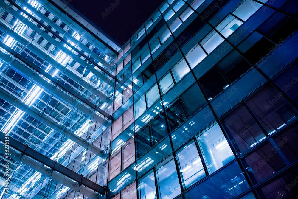 Obraz premium business office at night - corporate building