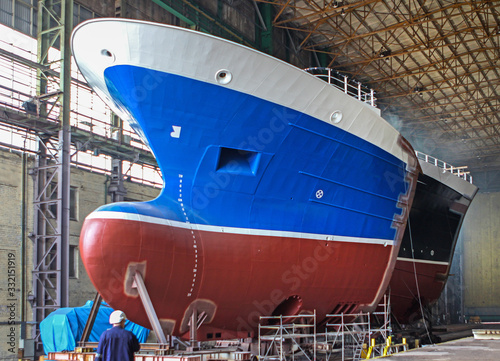 Ship building. Bow of ship construction at dry dock in shipyard. 