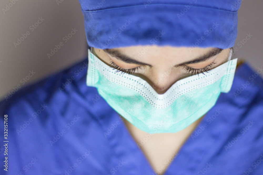 Fototapeta premium Aerial view of nurse with mask and hat to protect against coronavirus.