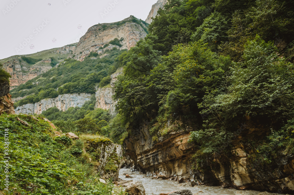 Cycling mountain road. Misty mountain road in high mountains.. Cloudy sky with mountain road Cycling mountain road. Misty mountain road in high mountains.. Cloudy sky with mountain road