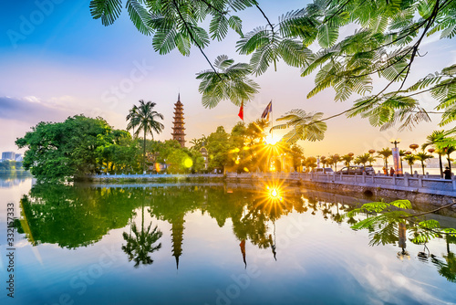 Tran Quoc pagoda in the afternoon in Hanoi, Vietnam. This pagoda locates on a small island near the southeastern shore of West Lake. This is the oldest Buddhist temple and tourist destination in Hanoi photo