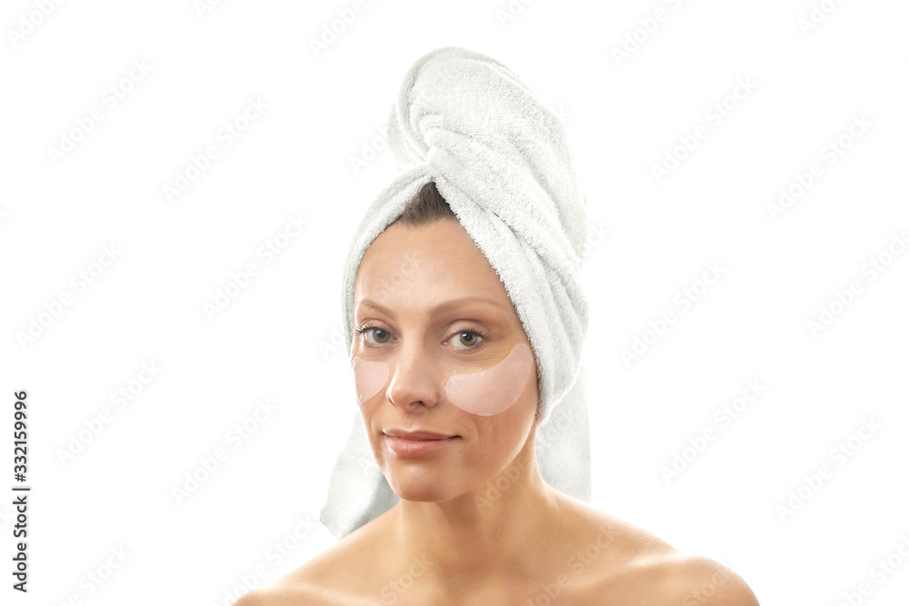 Beautiful middle-aged woman with patches for eyes against wrinkles. Beautiful middle-aged woman with patches for eyes against wrinkles.