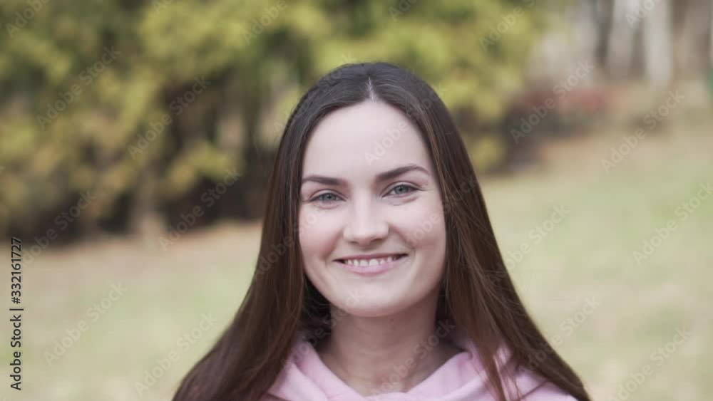 Portrait of cheerful smiling girl, slow motion Portrait of cheerful smiling girl, slow motion