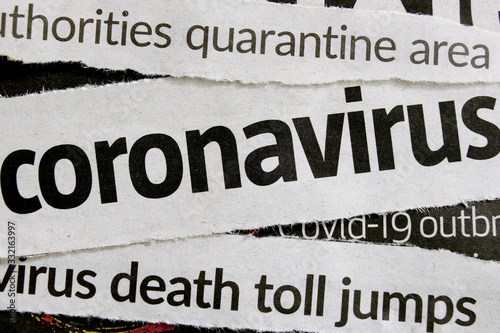 Novel coronavirus breaking news headline clippings from various newspapers reporting on the deadly disease, macro view. Concept for global coverage on severity of Covid-19 or 2019-ncov virus.