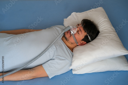 COVID-19 Pandemic Coronavirus; Close-up of young man using respirator machine for breathing